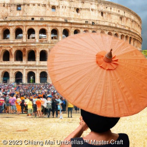 Protect from the heat with a Chiang Mai Classic Umbrella. Here at the Coloseum in Rome, Italy.